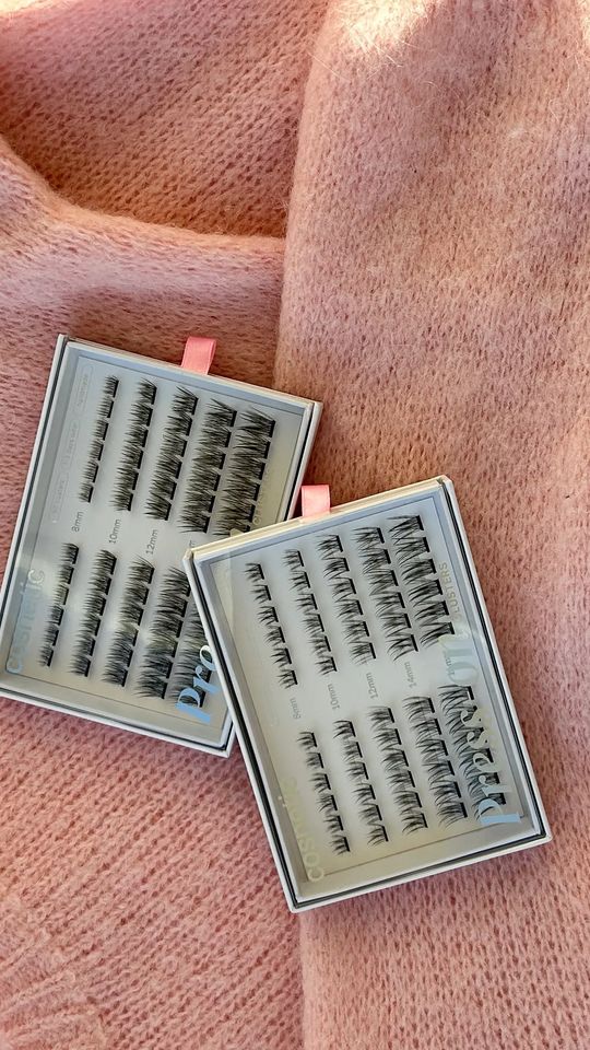 Cosnetic lashes on a pink knit